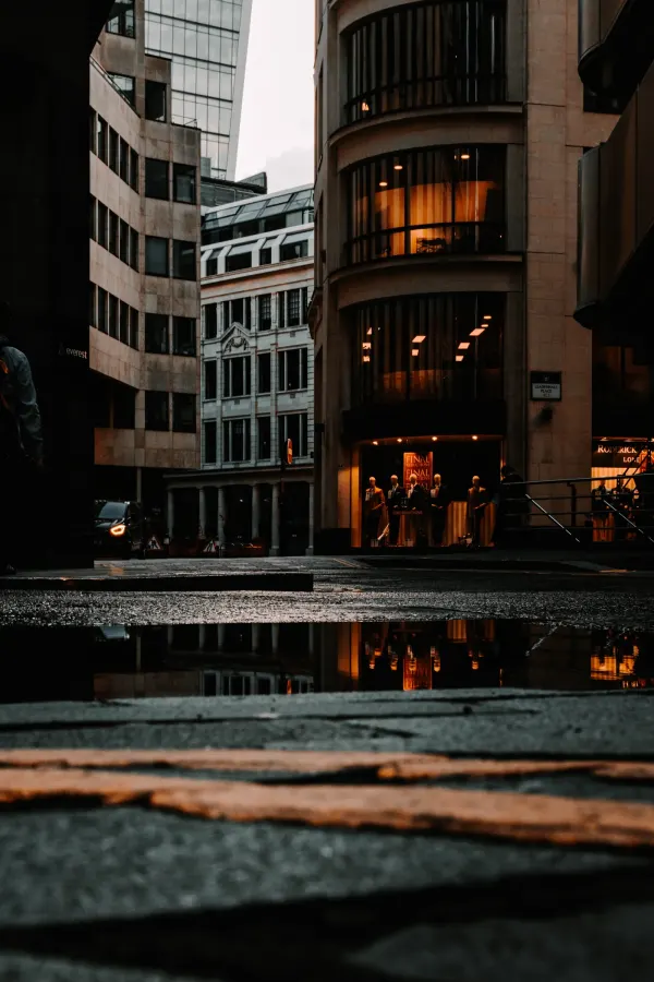 Moody London street with warm window light