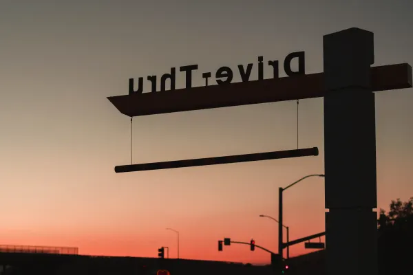 Drive-through sign at sunset